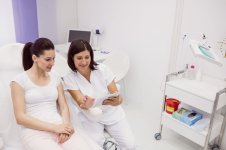 dermatologist-female-patient-discussing-digital-tablet_optimized_2000.jpg