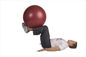 Table Top Leg Extensions with Exercise Ball